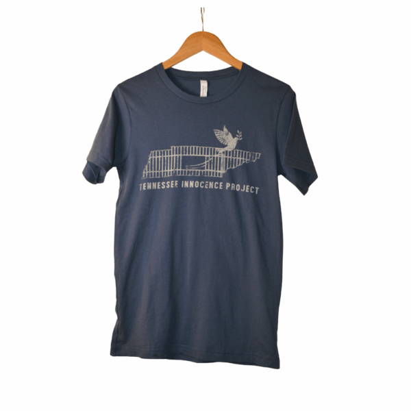 Navy Tennessee Innocence Project distressed logo t-shirt on a wooden hanger